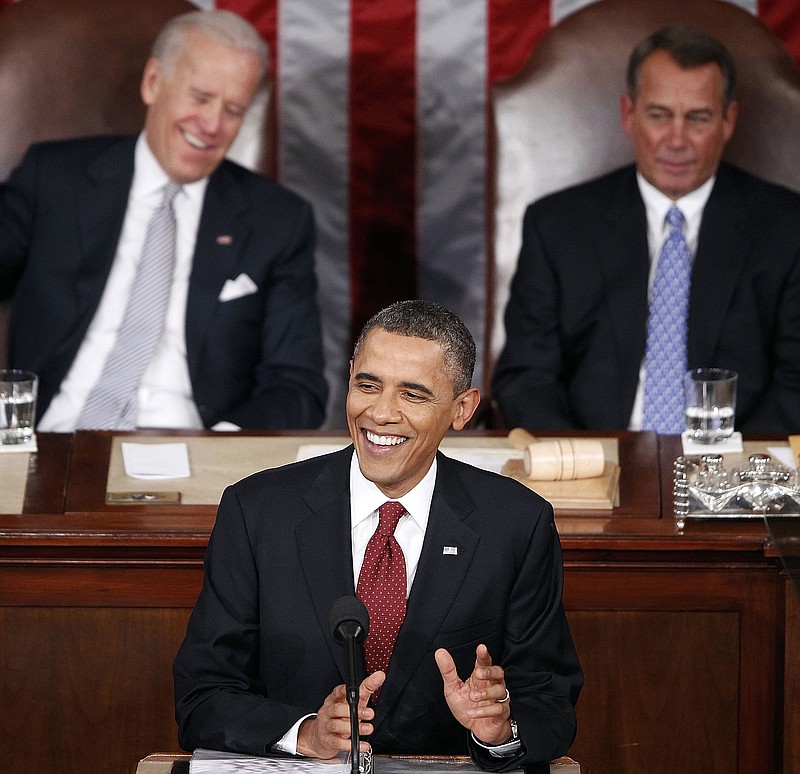 President Barack Obama delivers the State of the Union address Tuesday as Vice President Joe Biden, left, and House Speaker John Boehner of Ohio listen in the U.S. Capitol in Washington.