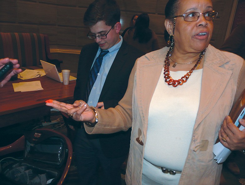 State Sen. Robin Wright Jones, D-St. Louis, tells reporters on Jan. 24, 2012, about "target" stickers posted that afternoon outside her office door at the Missouri Capitol.