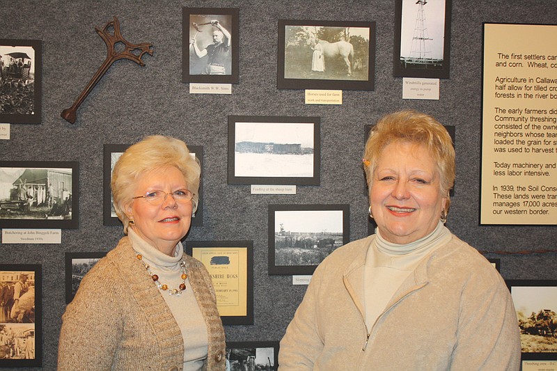 (Left) Carmen McEwen and Sheila Guthrie stand in front of The Kingdom at Work display at the National Churchill Museum. The exhibit opens Feb. 11.