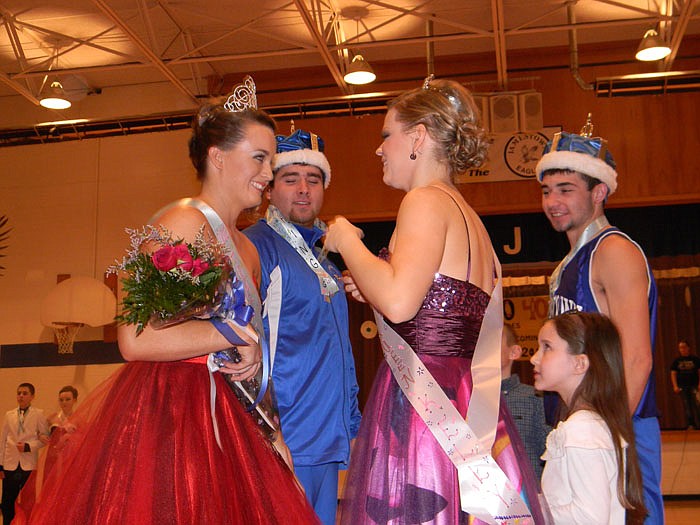 Josh Clevenger and Kelly Woods, 2011 Jamestown Homecoming King and Queen, crown 2012 Homecoming King and Queen Chad Cook and Morgan Imhoff at the 2012 "Decades" Jamestown Homecoming Coronation Ceremony held Friday, Jan. 20 after the basketball games against Calvary Lutheran.