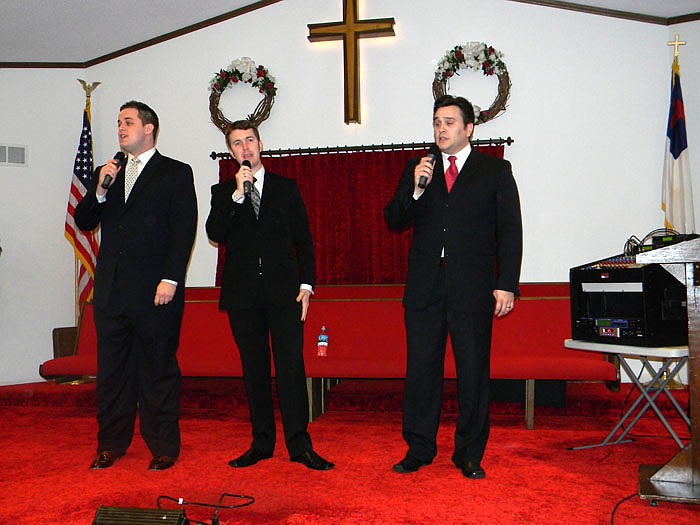 Promise Trio Andrew Bailes, left, T.J. Evans, middle, and David Mann, right, perform "Tell Me the Story of Jesus" during their concert held at Tipton Community Baptist Church Saturday, Jan. 21.
