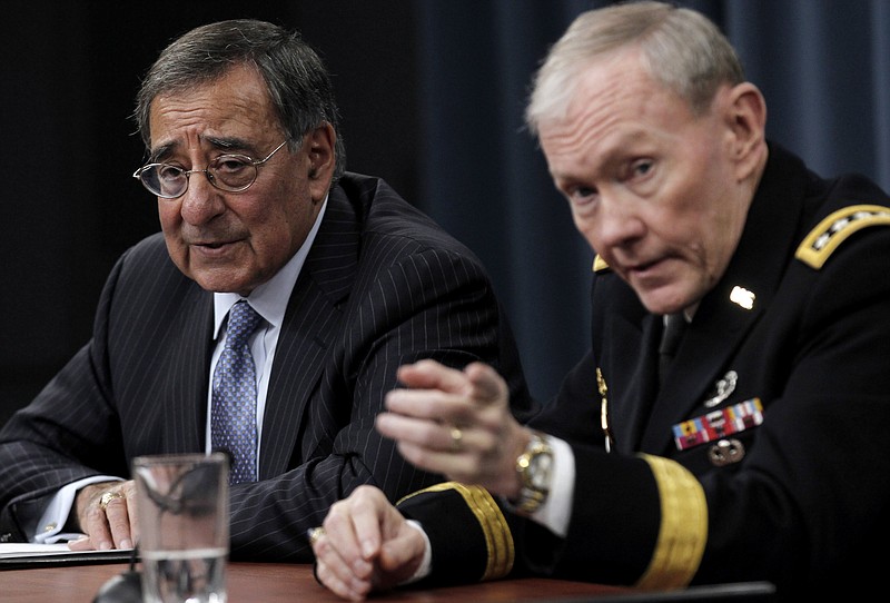 Defense Secretary Leon Panetta and Joint Chiefs Chairman Gen. Martin E. Dempsey outline the main areas of proposed spending cuts Thursday during a news conference at the Pentagon.