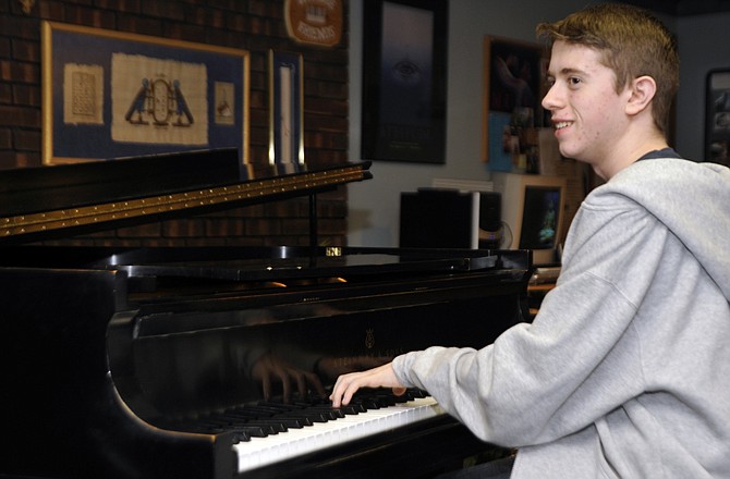 Edward Crouse practices pieces by Mozart and Hadyn during his piano lesson with instructor Jan Houser at her home on Boonville Road. On March 10, the Columbia Civic Orchestra will perform his composition, "The Tragedy of the Hero," during a concert at Columbia College.