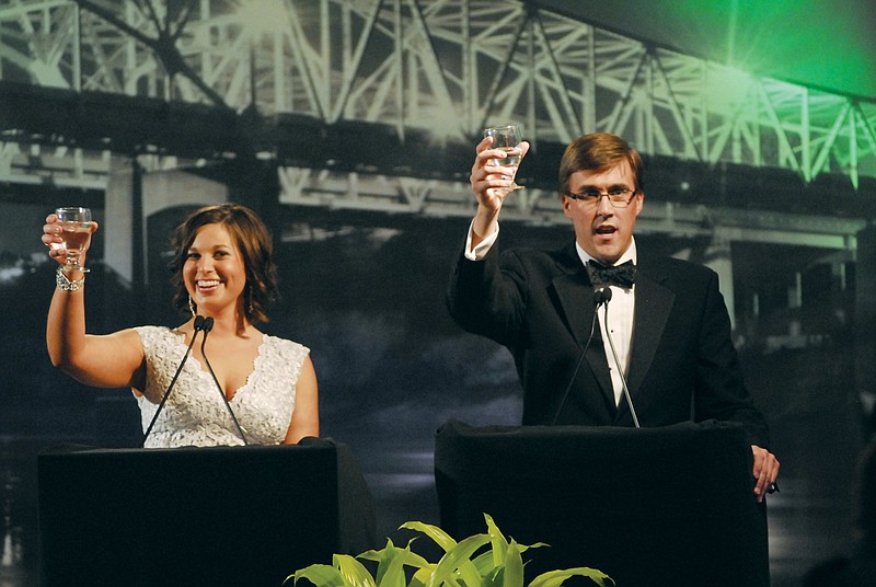 Sara Alsager and Dan Westhues announce a toast Friday as the masters of ceremony at the 119th Annual Jefferson City Area Chamber of Commerce Gala Awards Ceremony. 