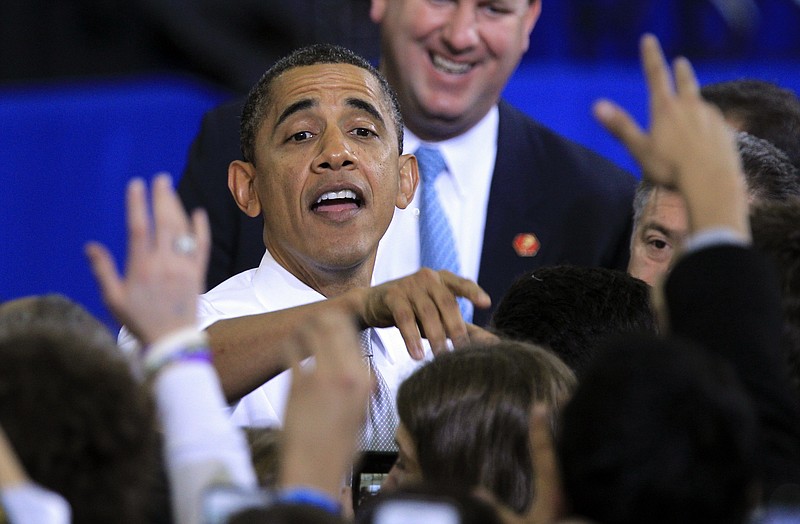 President Barack Obama greets supporters Friday after his speech at the University of Michigan in Ann Arbor, Mich.