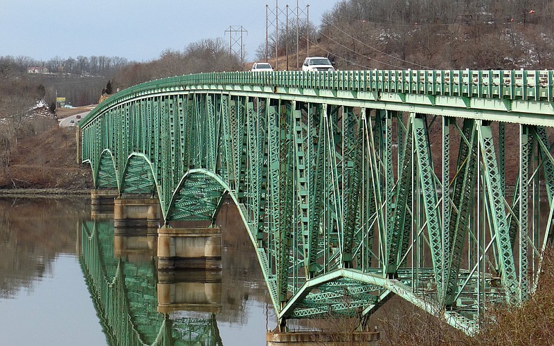 Cars pass over the Hurricane Deck Bridge in Sunrise Beach. Finalized plans for replacement of the aging structure calls for a new bridge to be built "about three feet west of the old bridge," according to MoDOT engineer Bob Lynch.