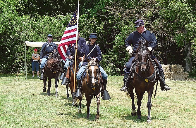 A group of re-enactors do some precision riding in a replicating the maneuvers of a Union calvary platoon at the 2010 Living History Days at the Camden County Museum. An expanded re-enactment is planned Sept. 15-16 in Linn Creek. 