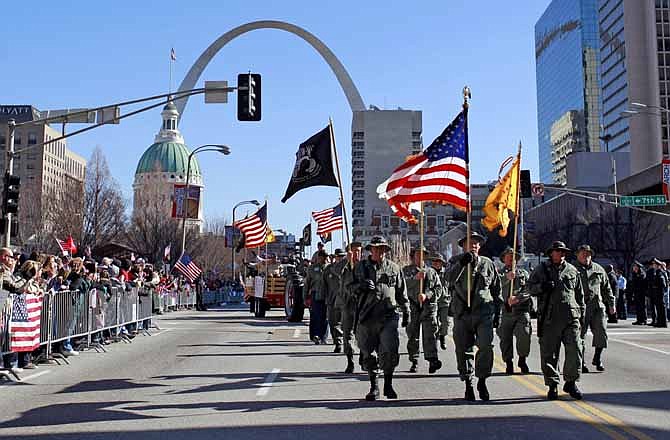 Participants in a parade to honor Iraq War veterans make their way along a downtown street Saturday, Jan. 28, 2012, in St. Louis. Thousands turned out to watch the first big welcome home parade in the U.S. since the last troops left Iraq in December.