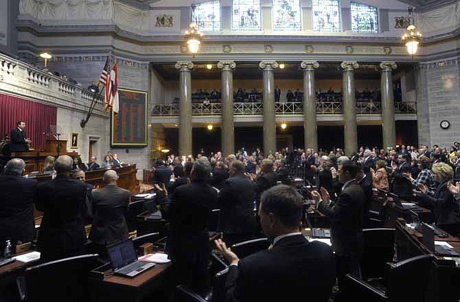 Members of the Missouri House of Representatives give House Speaker Steve Tilley, R-Perryville, left, a standing ovation following his opening day remarks Wednesday, Jan. 4, 2012. The General Assembly will be in regular session until Friday, May 18, 2012, but one proposal being studied in the Senate would shorten future annual sessions so they end in late March.