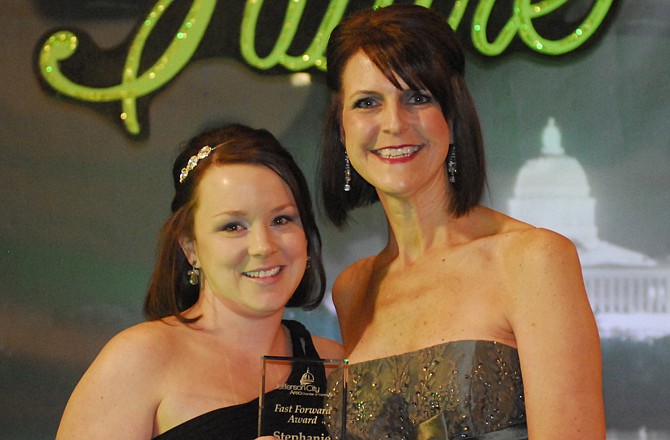 Stephanie Bell, left, was presented with the first Fast Forward Award by Janet Wear-Enloe at the 119th Annual Jefferson City Area Chamber of Commerce Gala Awards Ceremony.