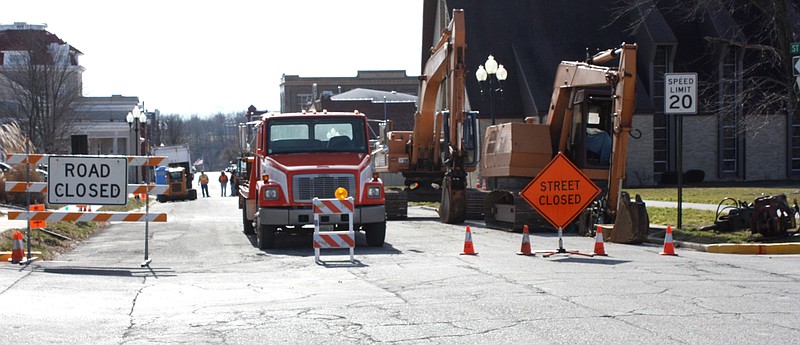 Workmen from Kauffman & Sons Excavating of Jefferson City Monday blocked off Court Street just south of 7th Street to begin work on replacing century-old city sewer lines along the street. The work is scheduled to be completed in a few weeks. This summer the street will be repaved where the sewer line replacement work will occur.