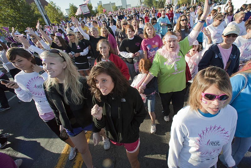 Some of an estimated 45,000 people participate in the Susan B. Komen Race for the Cure in October 2010 in Little Rock, Ark. The nation's leading breast-cancer charity, Susan G. Komen for the Cure, is halting its partnerships with Planned Parenthood affiliates in 2012 - creating a bitter rift, linked to the abortion debate, between two iconic organizations that have assisted millions of women.