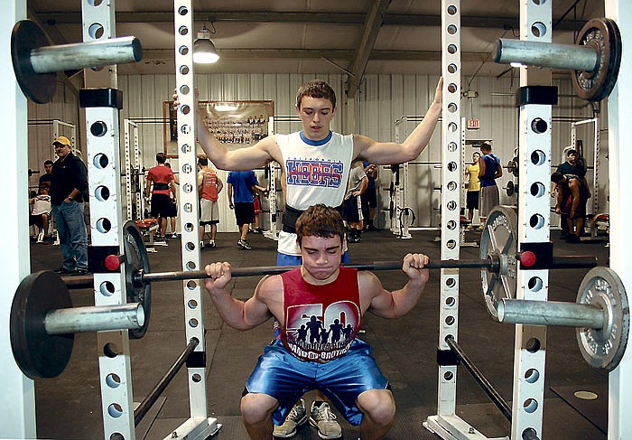 California Pinto football players lift weights before school on a recent Friday morning before school at the CHS weightlifting annex.