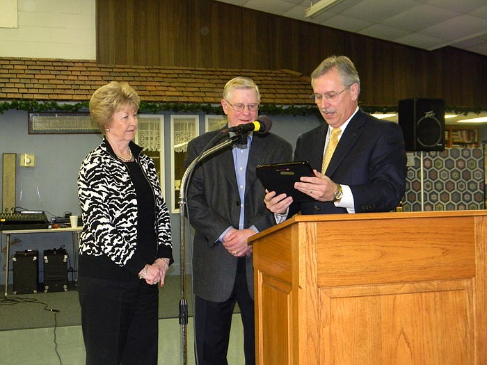 California First Baptist Church Pastor Greg Morrow, right, presents Owners Bud, middle, and Nancy Bolinger, Bolinger Marketing Group with the 2011 Business of the Year Award.
