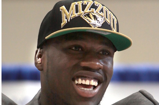 Dorial Green-Beckham smiles Wednesday morning, Feb. 1, 2012, after announcing he will play at Missouri at a news conference in Springfield.