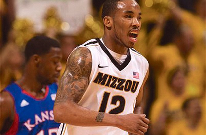 Missouri guard Marcus Denmon celebrates following the Tigers' 74-71 win against Kansas on Saturday at Mizzou Arena.