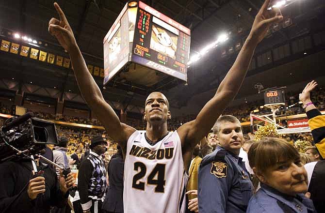 Missouri's Kim English celebrates as he walks off the court after his team defeated Kansas 74-71 in an NCAA college basketball game on Saturday, Feb. 4, 2012, in Columbia, Mo. 