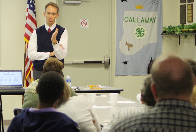 Thomas McAuliffe, a Missouri Foundation for Health policy analyst, discusses to the pros and cons of the new federal health care law during a seminar Monday at the Callaway County Expension Center.