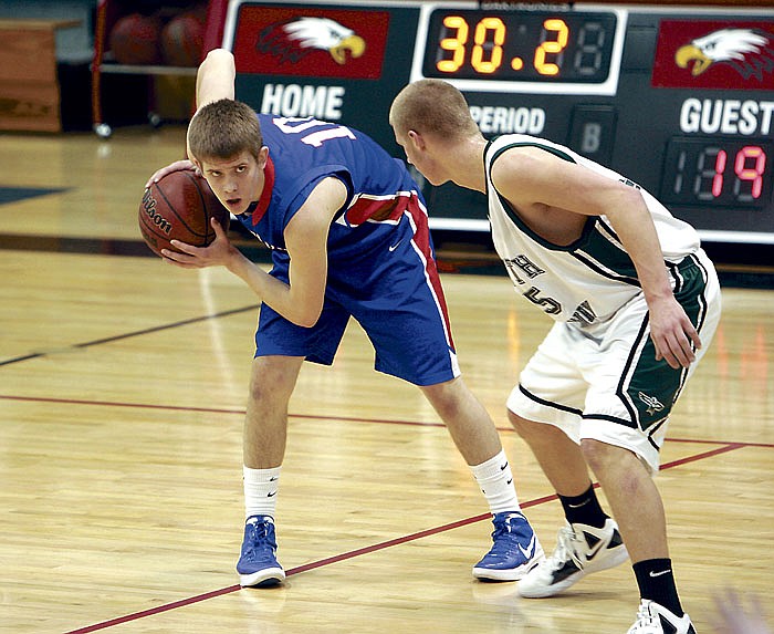 California's Nathanial Caudel, at left, looks for an open man during the semifinal game against North Callaway Thursday night at the Southern Boone Classic at Ashland. The Pintos defeated the Thunderbirds 64-48 to advance to the championship game Saturday.