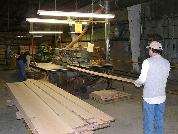 Chris Holden, left, and Mike Wood, right, prepare wood which will be used at California High School.