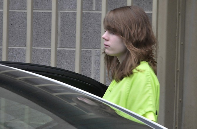 Eighteen-year-old Alyssa Bustamante is escorted out of the Cole County Courthouse to a waiting sheriff's vehicle, which took her to the Missouri Eastern Women's Prison in Vandalia. Bustamante was sentenced to life plus 30 years in prison on Wednesday for second degree murder and armed criminal action in the 2009 murder of 9-year-old Elizabeth Olten.