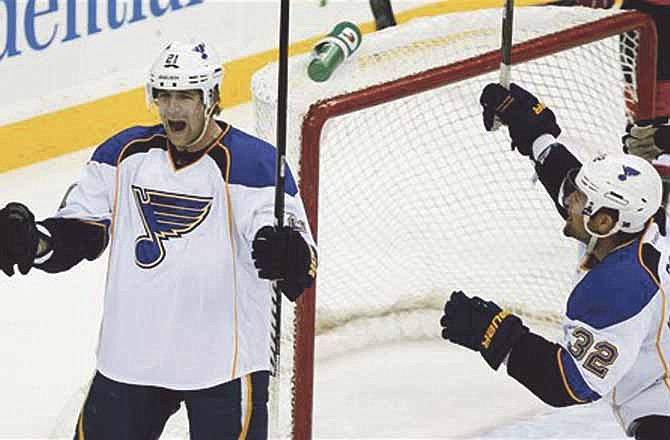 St. Louis Blues' Patrik Berglund (21), of Sweden, celebrates with teammate Chris Porter (32) after scoring a goal to tie the score during the third period of an NHL hockey game Thursday, Feb. 9, 2012, in Newark, N.J. The Blues won 4-3 in a shootout, which snapped the New Jersey Devils' five-game winning streak.