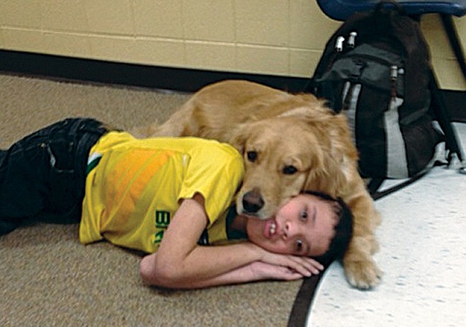 Michael Weber suffers from severe health issues, but now enjoys going to school and trying new things thanks to Scout, the therapy dog at Thomas Jefferson Middle School