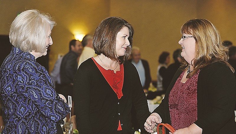 
Mary Young, at left, listens in as award-winning friends, Lori Massman, at right, and Lee Knernschield visit at United Way of Central Missouri annual meeting. Massman and Knernschield won the top awards for the year. Knernschield received  the 2011 Ruth C. Meloy Award, while Massman received the 2011 "Live United" Award.