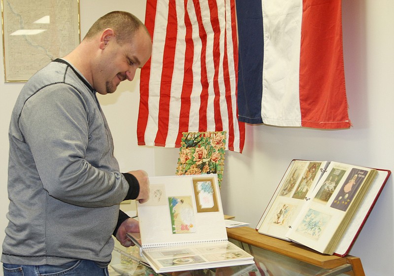 Craig Abbott, a member of the New Bloomfield R-3 Board of Education, checks out some of the antique valentines on display Saturday afternoon at the New Bloomfield Area Historical Society.