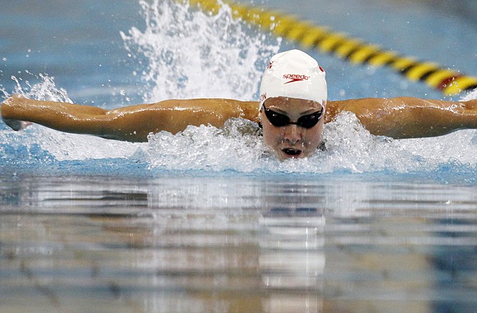 Juli Wilkinson swims to a first-place finish in the 200-meter individual medley at the Missouri Grand Prix swim meet on Sunday in Columbia.