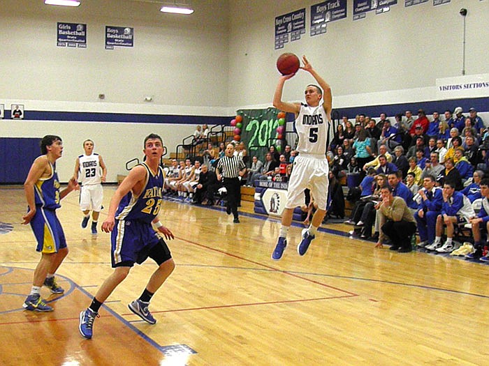 Russellville's Kaleb Payne hits the air to put up a shot during the second quarter of the Indians' Courtwarming game against Fatima. Russellville lost 68-53 to the Comets.