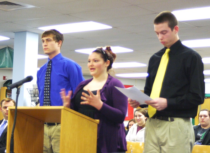 (From left) North Callaway High School Student Council members Cullen Hudson, Brynn Shaw and Jared Graves make a proposal before the school board Thursday night to develop an outdoor courtyard gathering space at the high school.