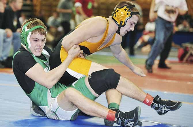 Blair Oaks' Eli Roberts pulls down Stanberry's Kevin Stoll during their 160-pound match Thursday at Mizzou Arena in Columbia. Roberts won the match 7-1. 