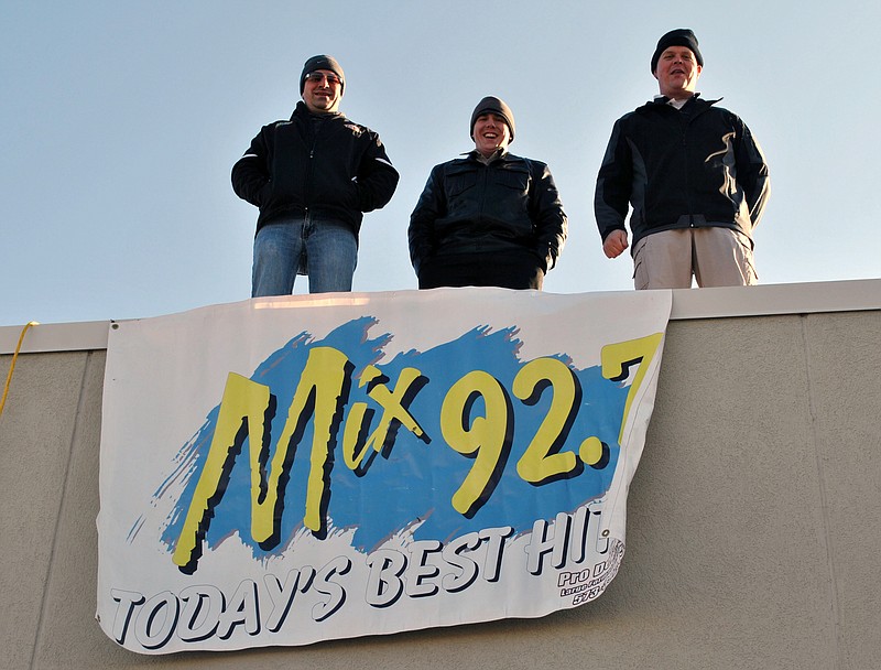 Police officers, firemen and other participants camp out on top of the Hy-Vee gas station from 6 a.m.-6 p.m. to raise hundreds of dollars to support Special Olympics Missouri. Pictured here are three participants, from left to right: Osage Beach Officer Brandon Wyrick, Osage Beach Explorer Nathan Wiederhoft and Brian Hoof of Mix 92.7 radio station.
