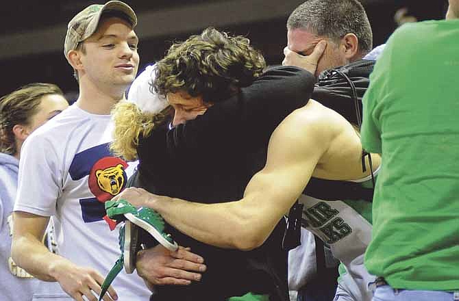 Craig Clark gets a tearful hug from his mom, Lisa, after the Blair Oaks senior made his way through the crowd to his family following his victory by fall over Lexington's Dallas Lamphier to claim the Class 1 170-pound championship Saturday night at Mizzou Arena. 