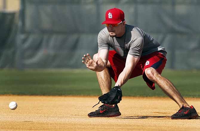 St. Louis Cardinals' Tyler Greene handles a grounder at second base during spring training baseball Saturday, Feb. 18, 2012, in Jupiter, Fla.