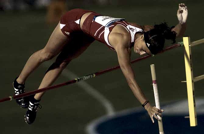 Vera Neuenswander clears the bar during the 2009 NCAA Outdoor Track and Field Championships in Fayetteville, Ark. The Jefferson City High School alumna plans to compete in the National Championships for a chance to represent the United States at the 2012 Olympics in London. 