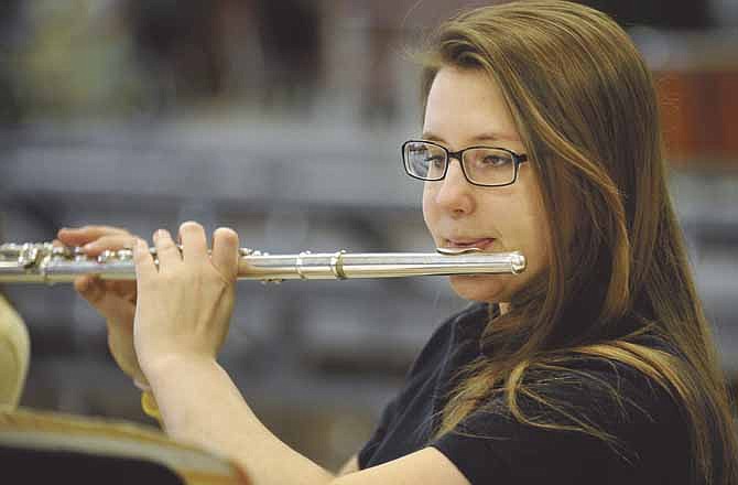 Shannon Merciel practices the flute in morning music class at Helias Catholic High School in Jefferson City.