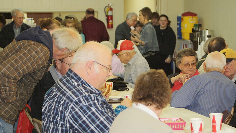 Callaway County residents gathered Monday at the Auxvasse Community Hall for a pulled pork lunch during their annual week-long observance of Loafer's Week.