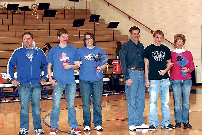 Senior members of the California High School Sounds of Joy were recognized during the Senior Night ceremony Monday at the high school. From left are Nathanial Caudel and parents Jeremy and Cher Caudel, and Grant Burger and parents Steven and Laura Burger.