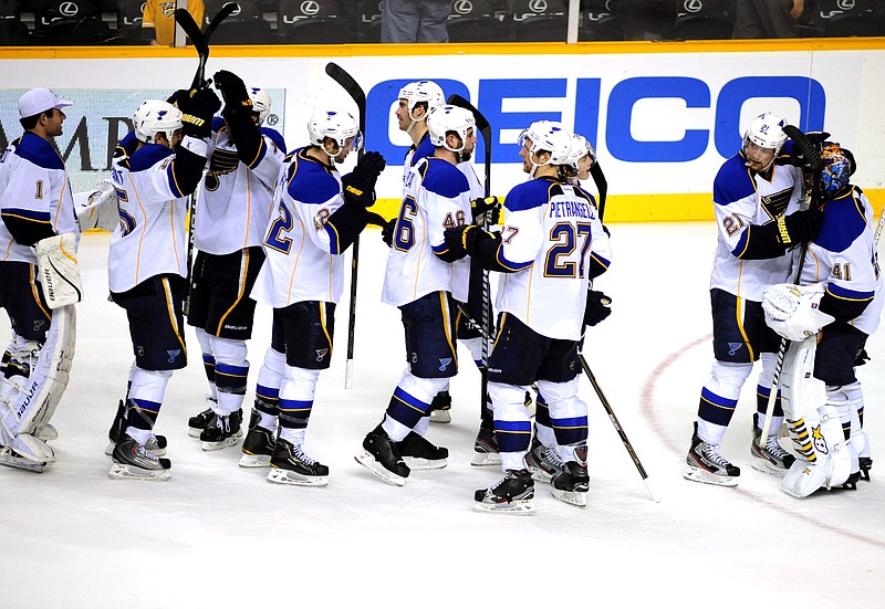 The Blues celebrate Thursday night's win over the Predators in Nashville, Tenn.