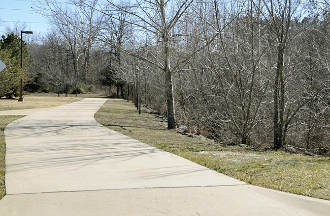 The issue is before the Jefferson City Council about whether JCMG will receive a deferment on building a sidewalk near their facility. One of the options includes a bridge over this creek to connect the existing Greenway trail with the proposed new sidewalk.