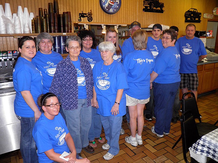 Doris "Tiny" Walters with family and friends who wore "Tiny's Team" shirts in support of her at the benefit auction held Sunday, Feb. 26, at Nic Nac Cafe.