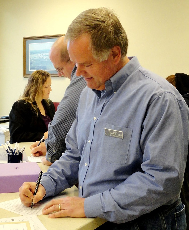 Filing for Callaway County offices Tuesday are Bryant Liddle, who filed as a Democratic candidate for Eastern District Commissioner, and Democratic Callaway County Assessor Dan Roe, who filed for re-election. In the background is Republican Callaway County Clerk Denise Hubbard.    