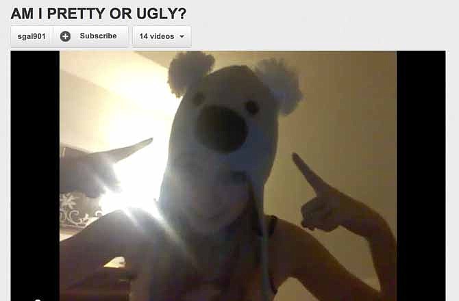 This image made on Friday, March 2, 2012 from video posted on the YouTube website on Dec. 17, 2010 shows a girl with a koala hat asking "Am I pretty or ugly?" The video has more than 4 million views and more than 107,000 anonymous, often hateful responses in a troubling phenomenon that has girls as young as 10 - and some boys - asking the same question on YouTube with similar results. 