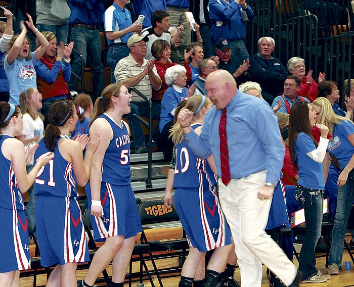 California Head Coach Bobby Sangster and the Lady Pintos react at the end of a very close championship game against Skyline at the Class 3 District 10 Girls Basketball Tournament Saturday at Versailles, which California won 50-45. The Lady Pintos advance to Class 3 Sectionals today (Wednesday) at the Missouri University of Science and Technology at Rolla, where they will play Hermann at 6 p.m.