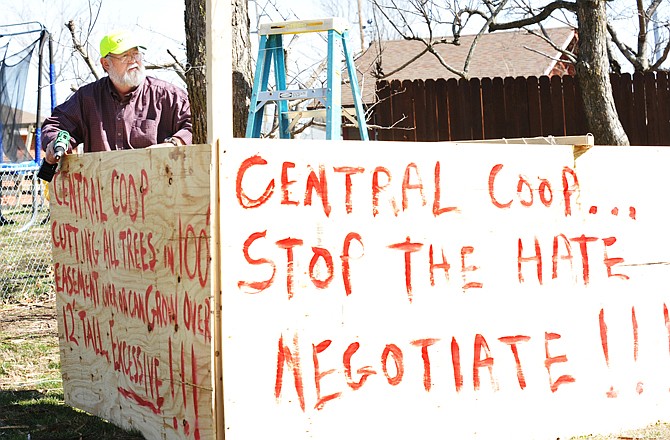 Dwight Lemons fights to save to the catalpa trees in the yard of his Biscayne Drive home in western Cole County. To that end, he's protesting Central Electric Co-op's decision to clear the right-of-way within 50 feet on the overhead transmission power lines. He's confident these trees would not cause an issue with the overhead lines and do not need to be removed.