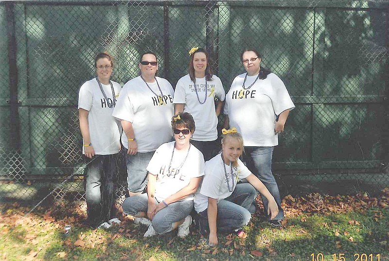Back, from left, Melody Seiger, Jennifer Drinkard, Reaba Vaugn, Sabrina Roemer. (front, from left) April Wimmer and Amber Harrison participated in the American Foundation for Suicide Prevention's Out of the Darkness Walk in St. Louis last fall.Seiger, whose mother completed suicide 18 years ago, is planning Fulton's first Out of the Darkness Walk in October. A kickoff event will be held from 6:30-8 p.m. on March 22 at the Fulton State Hospital Main Canteen.