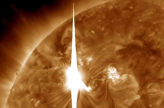 This handout image provided by NASA shows a solar flare heading toward Earth. Forecasters said the sun erupted Tuesday evening and the effects should start smacking Earth early Thursday.