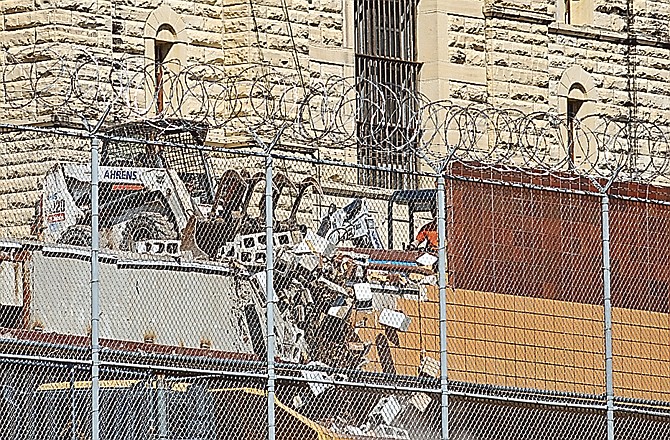 Work has begun on demolition on the grounds of the former Missouri State Penitentiary (MSP) as the buildings between A-Hall and McClung Hall, the school, library and chapel are torn down and hauled away load after load in dump trucks.